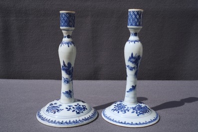 A pair of Chinese blue and white candlesticks, Kangxi/Qianlong